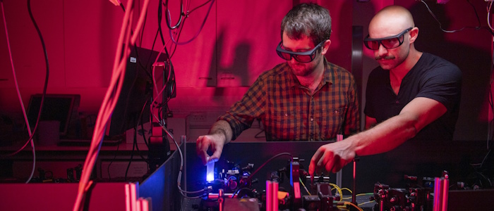 Two students using lab equipment in the School of Physics & Astronomy