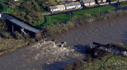 Collapsed bridge over river