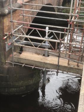 Metal poles making up monitoring system over water